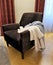 Armchair with clothes.