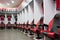 Armchairs for football players are standing against the wall in the locker room at the stadium Giuseppe Meazza or San Siro, built