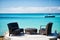 Armchairs and table on tropical beach in st johns, antigua