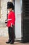 Armed beefeater standing post