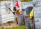 Armed man setting up victory flag in paintball mission