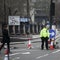 An armed police officer stands guard near Westminster Bridge and