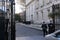 Armed police officers guarding buildings, London, England