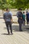 Armed security guard secureing the perimeter of the concourse at the entrance to the Yad Vashem museum in Jerusalem Israel as the