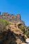 Armenia, Amberd, September 2022. The ruins of the walls of an ancient fortress against the sky.