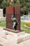 Armenia, Yerevan, September 2021. Sculpture of a man coming out of the wall, Guy Bussein.