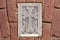 Armenian Christian cross carved in stone. Ancient ornamental christian cross on stone in church