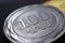 Armenian coins lie on a dark black surface close-up. 100 dram coin. Money of Armenia. News about economy or currency. Loan and