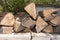 An armful of wood prepared for a campfire in a country house.