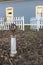 Armillary Sundial in a Garden with White Picket Fence