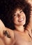 Armpit hair, natural growth and woman satisfied, smile and happy with female body, beauty and wellness. Afro hair, spa