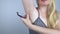 Armpit rash. Underarm skin irritation. Blonde girl shows irritation on the skin after using a razor, trimmer, deodorant or antiper