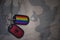 army blank, dog tag with flag of albania and gay rainbow flag on the khaki texture background.