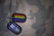 army blank, dog tag with flag of israel and gay rainbow flag on the khaki texture background.