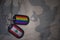 army blank, dog tag with flag of lebanon and gay rainbow flag on the khaki texture background.