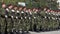 Army platoon,troops,at a parade blurred