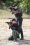Army soldiers in action tactical combat shooting from machine gun