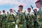 Army of soldiers with machine guns. A squad of fighters in red berets and green uniforms. Russian troops