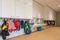 ARNHEM / NETHERLANDS - AUGUST 28 2020: Cloakroom with coats and backpacks in a school building for toddlers and young children