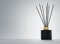 Aroma diffuser black ceramic bottle with gold cap and sticks 3D render