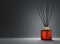 Aroma diffuser brown glass bottle with gold cap and sticks 3D render