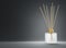 Aroma diffuser frosted glass bottle with gold cap and wooden sticks 3D render