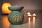 Aroma Lamp With Burning Candle. Aromatherapy. Spa Room. romantic atmosphere of a house with candles,