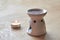 Aroma lamp with essential oil, burning candle, aromatherapy