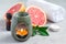 Aroma lamp with grapefruit essential oil, spa background, horizontal