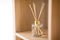 Aroma reed diffuser on wooden shelf