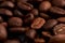 Aroma roasted coffee beans, brown at an angle background