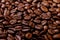 Aroma roasted coffee beans, brown background. Soft focus close up