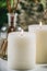 Aromatherapy Concept. Aromatic White Candles and Essential Oil Reed Diffusers