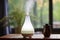 aromatherapy diffuser with fog on a wooden table