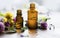 Aromatherapy essential oil bottles, herbal plants and oil