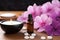 aromatherapy essentials: oil dropper and floating flowers