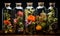 Aromatherapy, glass bottles with sprigs of flowers on a dark background.