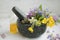 Aromatherapy. Natural medicinal plants and herbs in a mojar with pestle, natural floral extracts and oils, natural oils