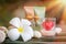 Aromatherapy product spa of therapy massage with plumeria or frangipani flowers, stones, aroma candle and oil on the desk,Spa