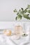 Aromatherapy. Small glass bottles with cosmetic oils. Bath salt. Fresh leaf. Objects for spa procedures on white background oil,