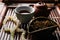 Aromatic Dianhong tea and prayer beads on wooden tray, closeup. Traditional ceremony