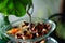 Aromatic dried herbs in a glass tray set in air-conditioned cafe. 2