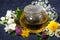 Aromatic flower tea in a teapot, closeup