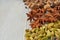 Aromatic Indian spices on the gray kitchen table: star anise, nutmeg, cardamom close up. Spices texture background with copy space