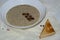 Aromatic mushroom cream soup with champignons. Fresh vegetables and freshly baked bread. A hearty and delicious lunch.