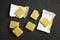 Aromatic natural bouillon cubes on table, flat lay