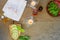 Aromatic oil, burned candle, pink flowers, sliced lime, green leaf, white towel on vintage grunge stone background