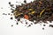 Aromatic, pungent, black tea with dry berries and flowers on white backround.