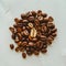 Aromatic roasted coffee beans scattered on a white background