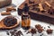 Aromatic seeds essential oil on glass bottle